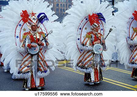 parade, band, Philadelphia, PA, Pennsylvania, Members of a String Band dressed in ornate patriotic costumes play their banjos and strut in the Mummers Day Parade on New Years Day in Philadelphia. View Large Photo Image Stock Photograph - parade, band, Philadelphia, PA, Pennsylvania, Members of a String Band dressed in ornate patriotic costumes play their banjos and strut in the Mummers Day Parade on New Years Day in Philadelphia.. Fotosearch