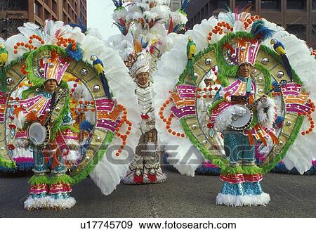 parade, costume, band, Philadelphia, PA, Pennsylvania, Members of a String Band dressed in fancy colorful costumes with feathers play their banjos and strut in the Mummers Day Parade on New Years Day in Philadelphia. View Large Photo Image Stock Photo - parade, costume, band, Philadelphia, PA, Pennsylvania, Members of a String Band dressed in fancy colorful costumes with feathers play their banjos and strut in the Mummers Day Parade on New Years Day in Philadelphia.. Fotosearch