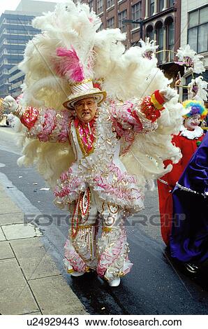 parade, costume, Philadelphia, PA, Pennsylvania, A man dressed in a fancy white suit with feathers struts in the Fancy Division in the Mummers Day Parade on New Years Day in Philadelphia. View Large Photo Image Stock Image -  parade, costume, Philadelphia, PA, Pennsylvania, A man dressed in a fancy white suit with feathers struts in the Fancy Division in the Mummers Day Parade on New Years Day in Philadelphia.. Fotosearch