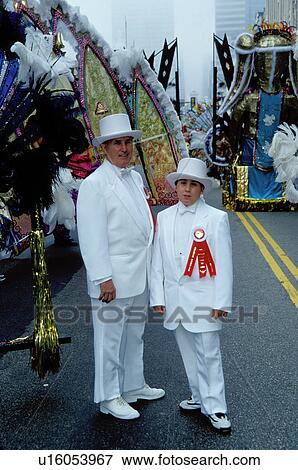 parade, costume, Philadelphia, PA, Pennsylvania, A father and son dressed in white suits and top hats pose for a picture in the Mummers Day Parade on New Years Day in Philadelphia. View Large Photo Image Stock Photo -  parade, costume, Philadelphia, PA, Pennsylvania, A father and son dressed in white suits and top hats pose for a picture in the Mummers Day Parade on New Years Day in Philadelphia.. Fotosearch
