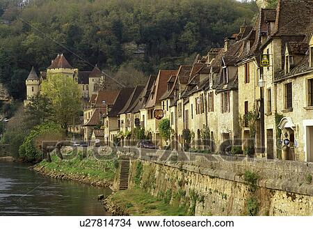 Picture -  Perigord, France, Dordogne, La Roque Gageac, Aquitaine, Europe, The medieval village of La Roque Gageac is nestled under limestone cliffs along bank of the Dordogne River.. Fotosearch
