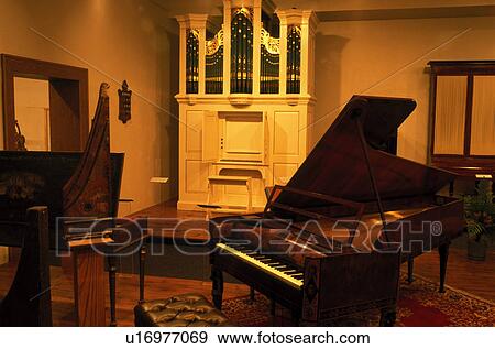 Stock Photo -  piano, music, university, Vermillion, SD, South Dakota, University of South Dakota, Musical instruments displayed inside the America's Shrine to Music Museum at the University of South Dakota.. Fotosearch