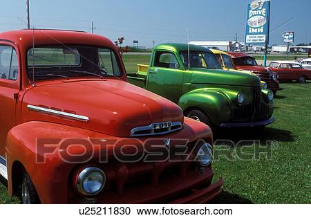 Stock Image -  pick up truck, MN, Minnesota, Colorful antique pick-up trucks on display at Lake Park.. Fotosearch