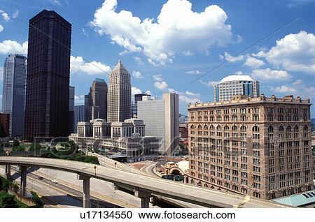 Stock Image -  Pittsburgh, PA, Pennsylvania, Penn Central Railroad Station (AMTRAK) and downtown skyline of Pittsburgh, PA. Fotosearch