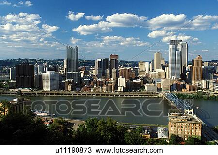 Stock Image -  Pittsburgh, skyline, PA, Pennsylvania, Aerial view of the downtown skyline of Pittsburgh and Smithfield Street Bridge (truss-type bridge) crossing the Monongahela River.. Fotosearch