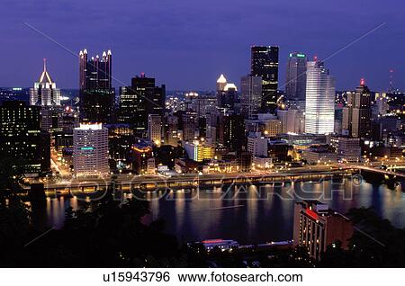 Stock Photograph -  Pittsburgh, skyline, PA, Pennsylvania, Aerial view of the downtown skyline of Pittsburgh along the Monongahela River at night.. Fotosearch