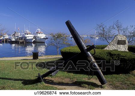 Picture -  Plymouth, Massachusetts, MA, View of Captain John Whale Watching boats docked in Plymouth Harbor from a park in Plymouth in the autumn.. Fotosearch