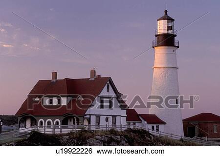 Stock Photograph -  Portland Head Light, lighthouse, Cape Elizabeth, Maine, ME, Portland Head Light on Cape Elizabeth at sunset in Fort Williams Park on the Atlantic Ocean. . Fotosearch