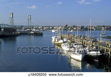 Stock Photography -  Portsmouth, NH, New Hampshire, Fishing boats docked at a marina in Portsmouth Harbor in Portsmouth in the autumn.. Fotosearch