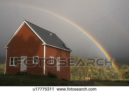 rainbow, Waterbury, VT, Vermont, A colorful rainbow appears over a small red house after a storm. View Large Photo Image Stock Image - rainbow, Waterbury, VT, Vermont, A colorful rainbow appears over a small red house after a storm. . Fotosearch