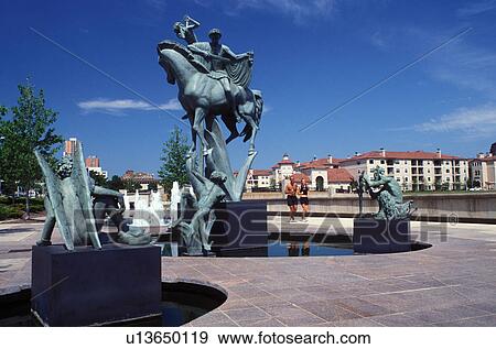 Stock Photo -  recreation path, Kansas City, MO, Missouri, Statue on the riverwalk along Brush Creek.. Fotosearch