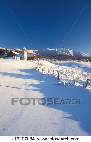 red barn, farm, winter scene, mountain, winter, snow, Mt. Mansfield, Scenic view of the snow covered Mount Mansfield and a red barn on a farm on a sunny day in the winter in Cambridge in Lamoille County in the state of Vermont. View Large Photo Image Picture - red barn, farm, winter scene, mountain, winter, snow, Mt. Mansfield, Scenic view of the snow covered Mount Mansfield and a red barn on a farm on a sunny day in the winter in Cambridge in Lamoille County in the state of Vermont. . Fotosearch