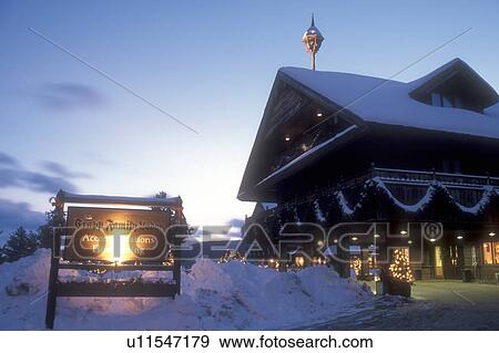 Stock Photo -  resort, country inn, Trapp Family Lodge, Stowe, TFL, Vermont, VT, Christmas lights decorate the Trapp Family Lodge in the evening in Stowe in the winter.. Fotosearch