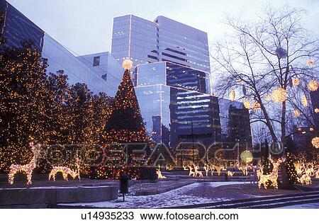 Stock Image -  Richmond, VA, Virginia, Christmas decorations at 12th and Cary Streets in downtown Richmond in the evening.. Fotosearch