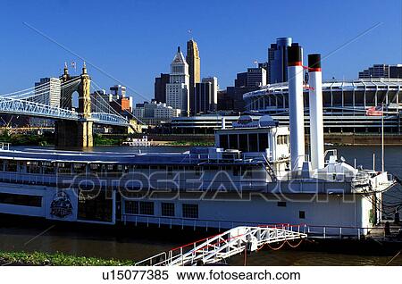 riverboat, Cincinnati, OH, Ohio, downtown skyline, Mike Fink Restaurant, a stern-wheeler riverboat on Riverboat Row, along the Ohio River. Downtown skyline and Cinergy Field across the Ohio River. View Large Photo Image Stock Photography - riverboat, Cincinnati, OH, Ohio, downtown skyline, Mike Fink Restaurant, a stern-wheeler riverboat on Riverboat Row, along the Ohio River. Downtown skyline and Cinergy Field across the Ohio River.. Fotosearch