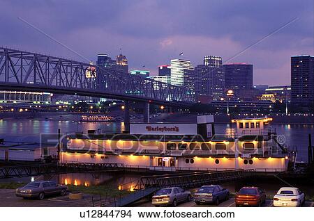 Picture -  riverboat, skyline, Cincinnati, OH, Ohio, Barleycorn's Riverboat Restaurant along Riverboat Row on the Ohio River and Taylor-Southgate Bridge, downtown skyline of Cincinnati in the evening. . Fotosearch