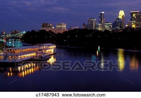 riverboat, skyline, Minneapolis, MN, Minnesota, Twin Cities, Riverboats illuminated at night at Boom Island Park along the Mississippi River. Downtown skyline in the background. View Large Photo Image Stock Image - riverboat, skyline, Minneapolis, MN, Minnesota, Twin Cities, Riverboats illuminated at night at Boom Island Park along the Mississippi River. Downtown skyline in the background.. Fotosearch