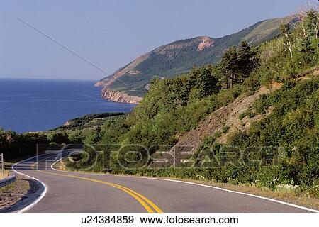 Stock Photo -  road, Cabot Trail, Cape Breton, Nova Scotia, NS, Canada, The scenic Cabot Trail winds along seacoast of Cape Breton Highlands National Park on the Gulf of St. Lawrence in Cape Breton. . Fotosearch