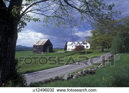 Stock Image -  road, spring, Calais, VT, Vermont, Scenic view of a farm and stonewall along a country road in the spring in Calais.. Fotosearch