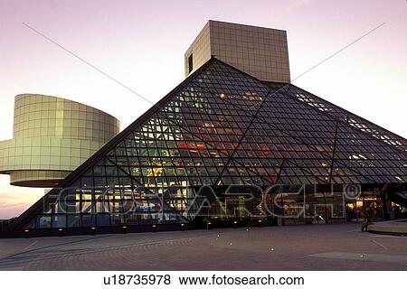 Stock Photo -  rock 'n roll, hall of fame, Cleveland, OH, Ohio, Rock and Roll Hall of Fame and Museum at sunset.. Fotosearch