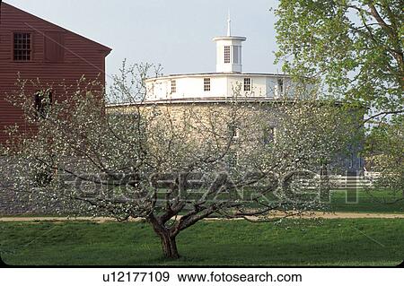 Stock Photo -  round barn, shakers, Pittsfield, Massachusetts, The Berkshires, Round Stone Barn at the Hancock Shaker Village in Pittsfield, Massachusetts in the spring.. Fotosearch