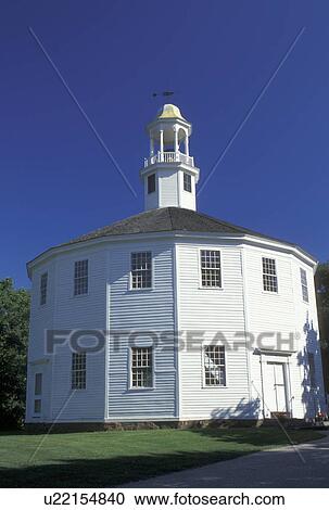 Stock Image -  round church, Vermont, VT, The Old Round Church National Historic Landmark in Richmond. 16-sided polygon, blue sky. Fotosearch
