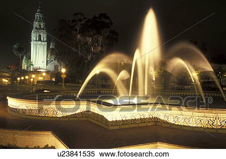 Stock Photography -  San Diego, California, CA, Fountain at Plaza de Panama and view of California Tower at Balboa Park in the evening in San Diego.. Fotosearch