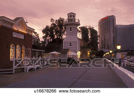 Stock Photograph -  San Diego, California, CA, Seaport Village a modern shopping and dining complex in San Diego in the evening.. Fotosearch