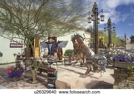 Stock Image -  Scottsdale, Arizona, AZ, Sculptures outside of Bischoffs Store in Old Town Scottsdale in downtown Scottsdale.. Fotosearch