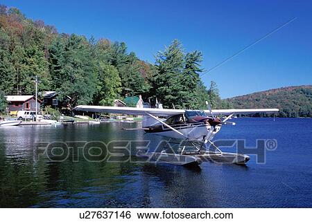 seaplane, Adirondacks, Fulton, New York, NY, Seaplane on the Chain Lakes Inlet in the Addirondack Mountains. View Large Photo Image Stock Photograph - seaplane, Adirondacks, Fulton, New York, NY, Seaplane on the Chain Lakes Inlet in the Addirondack Mountains.. Fotosearch