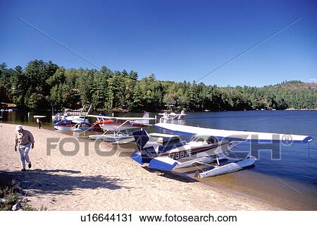 Stock Image -  seaplane, Adirondacks, Long Lake, New York, NY, Seaplanes along the beach at Long Lake in the Adirondack Mountains.. Fotosearch