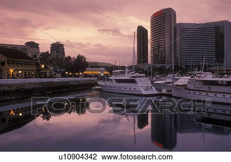 shopping center, San Diego, California, CA, Seaport Village a modern shopping and dining complex on San Diego Bay and the downtown skyline of San Diego in the evening. View Large Photo Image Stock Image - shopping center, San Diego, California, CA, Seaport Village a modern shopping and dining complex on San Diego Bay and the downtown skyline of San Diego in the evening.. Fotosearch