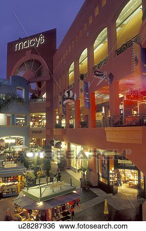Stock Photograph -  shopping center, San Diego, California, CA, Westfield Shoppingtown Horton Plaza an open-air, multi-level complex in downtown San Diego in the evening.. Fotosearch