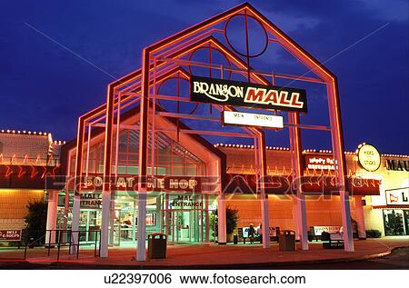 Stock Photograph -  shopping mall, neon, lights, Branson, MO, Missouri, Branson Mall is illuminated with neon lights in the evening.. Fotosearch