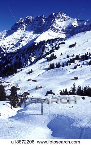 Stock Photograph -  ski resort, Alps, Switzerland, Valais, Les Crosets, Portes du Soleil, Swiss Alps, Europe, Dents du Midi, Scenic view of the Portes du Soleil ski resort the largest international and linked ski area in the world in the Swiss Alps.. Fotosearch
