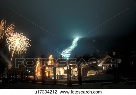 ski resort, Stowe, fireworks, torch light, skiing, holiday, evening, winter, Vermont, Firework display and torchlight parade at the Festival of Lights at Stowe Mountain Resort on a snow covered night in Stowe in Lamoille County in the state of Vermont. View Large Photo Image Stock Image - ski resort, Stowe, fireworks, torch light, skiing, holiday, evening, winter, Vermont, Firework display and torchlight parade at the Festival of Lights at Stowe Mountain Resort on a snow covered night in Stowe in Lamoille County in the state of Vermont. . Fotosearch