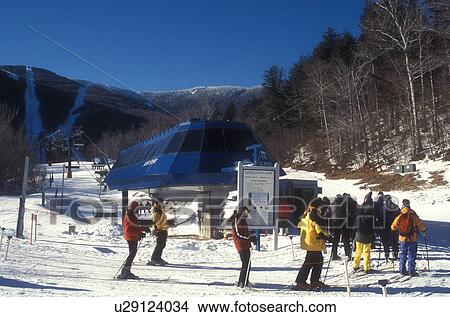 skiing, winter, Warren, VT, Vermont, Skiers waiting in line at the quad chair lift at Sugarbush Ski Resort in Warren in winter. View Large Photo Image Picture - skiing, winter, Warren, VT, Vermont, Skiers waiting in line at the quad chair lift at Sugarbush Ski Resort in Warren in winter.. Fotosearch