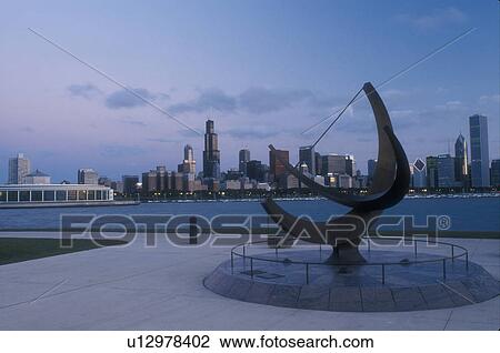 skyline, Chicago, Illinois, IL, Lake Michigan, Downtown skyline of Chicago and Chicago Harbor in the evening on Lake Michigan from Adler Planetarium. Sundial in foreground. View Large Photo Image Stock Image - skyline, Chicago, Illinois, IL, Lake Michigan, Downtown skyline of Chicago and Chicago Harbor in the evening on Lake Michigan from Adler Planetarium. Sundial in foreground.. Fotosearch