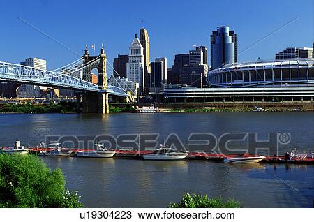 Stock Image -  skyline, Cincinnati, bridge, OH, Ohio, Downtown skyline, John A. Roebling Suspension Bridge, Ohio River, Cinergy Field.. Fotosearch