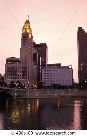 Stock Image -  skyline, Columbus, OH, Ohio, Downtown skyline, Scioto River, sunrise.. Fotosearch