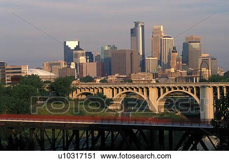 skyline, Minneapolis, MN, Minnesota, Twin Cities, Downtown skyline of Minneapolis and Stone Arch Bridge along the Mississippi River. View Large Photo Image Stock Image - skyline, Minneapolis, MN, Minnesota, Twin Cities, Downtown skyline of Minneapolis and Stone Arch Bridge along the Mississippi River. . Fotosearch