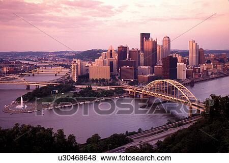 skyline, Pittsburgh, bridge, PA, Pennsylvania, aerial, View of the downtown skyline of Pittsburgh and the Fort Pitt Bridge crossing the Monongahela River. View Large Photo Image Stock Photo - skyline, Pittsburgh, bridge, PA, Pennsylvania, aerial, View of the downtown skyline of Pittsburgh and the Fort Pitt Bridge crossing the Monongahela River.. Fotosearch