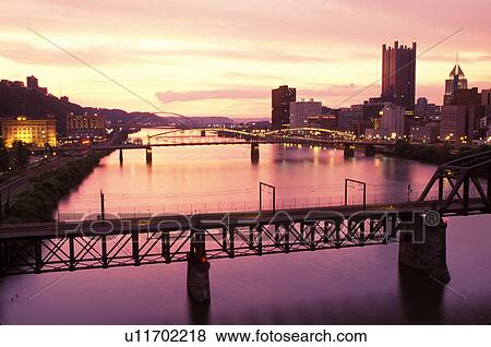 skyline, Pittsburgh, PA, Pennsylvania, Downtown skyline of Pittsburgh along the Monongahela River at sunset. View Large Photo Image Stock Photo - skyline, Pittsburgh, PA, Pennsylvania, Downtown skyline of Pittsburgh along the Monongahela River at sunset.. Fotosearch