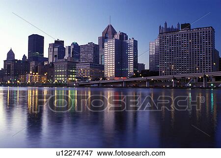 Stock Photo -  skyline, Pittsburgh, PA, Pennsylvania, downtown skyline of Pittsburgh, evening, Allegheny River at sunset.. Fotosearch