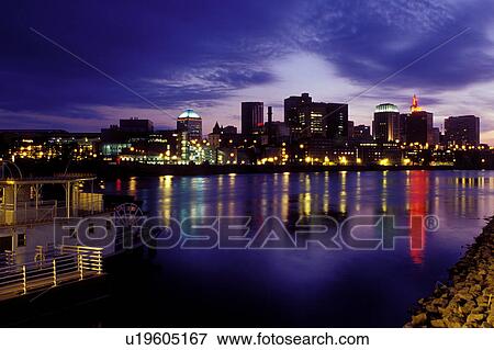 Stock Photo -  skyline, Saint Paul, MN, Minnesota, Twin Cities, Mississippi River, Downtown skyline of St. Paul along the Mississippi River in the evening. . Fotosearch