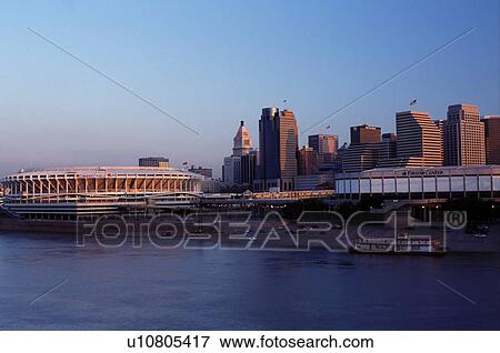 Stock Photo -  skyline, stadium, Cincinnati, OH, Ohio, Cinergy Field, Firstar Center and downtown skyline of Cincinnati across the Ohio River at sunrise. . Fotosearch