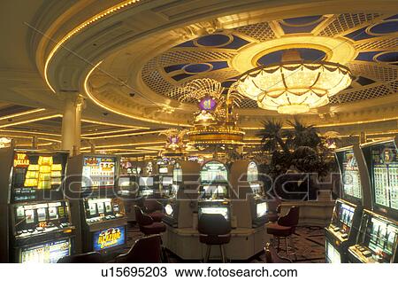 Stock Image -  slot machines, Las Vegas, casino, Nevada, NV, The Strip, Slot machines inside the casino at the Monte Carlo Resort & Casino in Las Vegas, the Entertainment Capital of the World.. Fotosearch