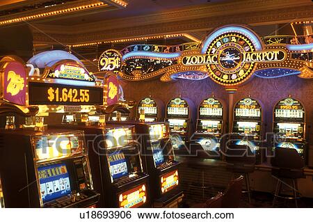 Stock Photograph -  slot machines, Las Vegas, casino, Nevada, NV, The Strip, Slot machines inside the casino at the Monte Carlo Resort & Casino in Las Vegas, the Entertainment Capital of the World.. Fotosearch