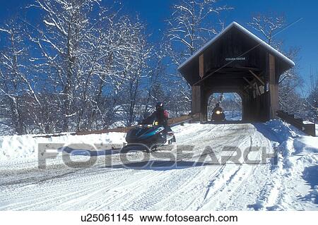 snowmobile, covered bridge, winter, East Montpelier, VT, Vermont, People snowmobiling over the Coburn Covered Bridge in East Montpelier in winter. View Large Photo Image Stock Photography - snowmobile, covered bridge, winter, East Montpelier, VT, Vermont, People snowmobiling over the Coburn Covered Bridge in East Montpelier in winter.. Fotosearch