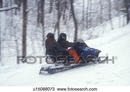 snowmobile, winter, VT, Vermont, Two people snowmobiling on a trail in winter. View Large Photo Image Stock Image - snowmobile, winter, VT, Vermont, Two people snowmobiling on a trail in winter.. Fotosearch